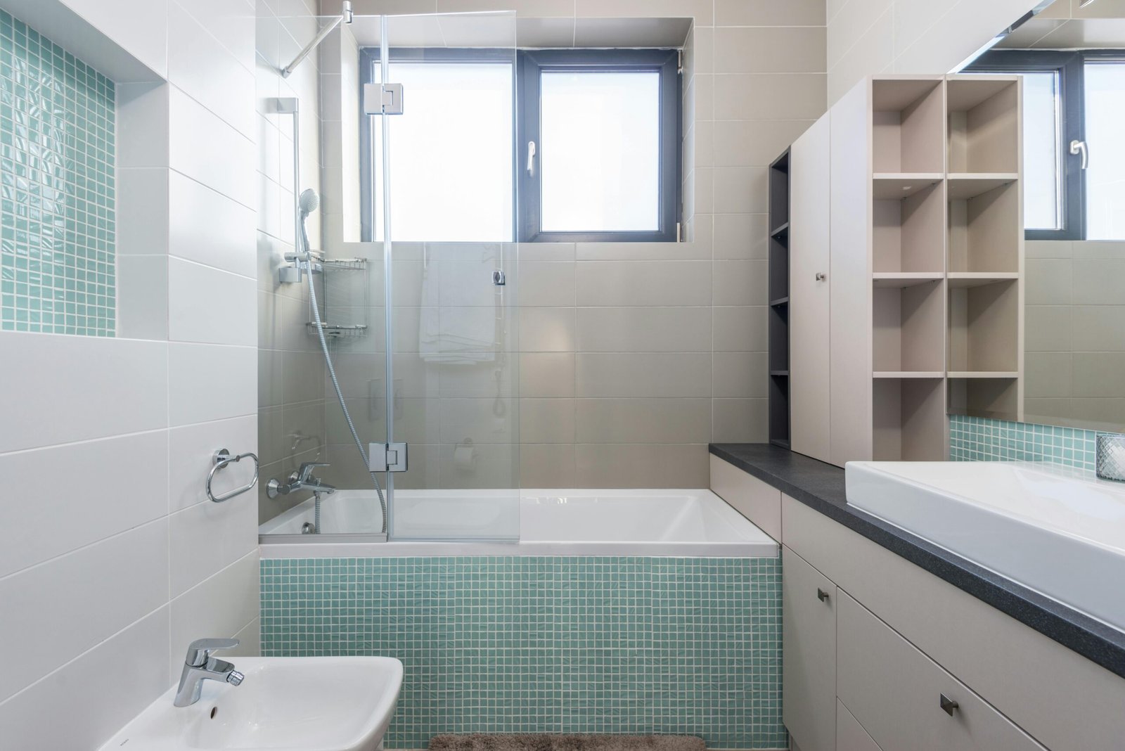 A sleek and contemporary bathroom featuring minimalist design and modern amenities.